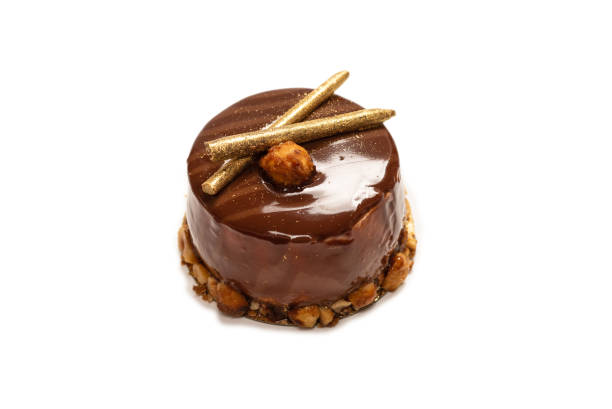 istock Chocolate and caramel cake isolated on a white background. 1318456820