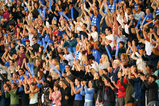 istock Spectators cheering on a stadium for the blue team 1318457456