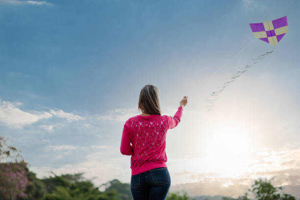 istock A young woman flying a kite 1318459182