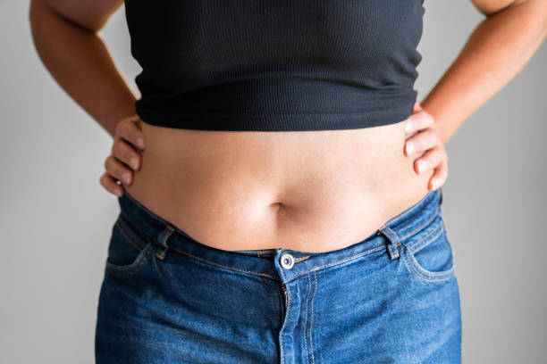 Fat Woman Belly Button And Body Fat Woman Belly Button And Body On Diet human abdomen stock pictures, royalty-free photos & images