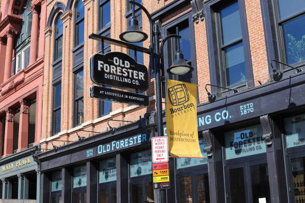 A sign for the Old Forester Distilling Co Louisville, Kentucky  USA-February 25, 2021: A sign for the Old Forester Distilling Co. in downtown Louisville, Kentucky on Whiskey Row derby city stock pictures, royalty-free photos & images