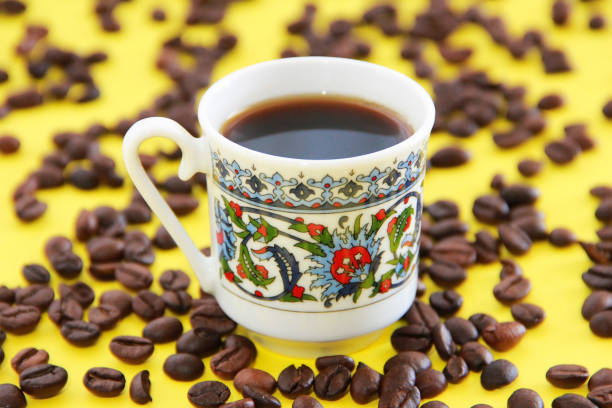 istock black turkish coffee in a mug and natural coffee beans 1318462562