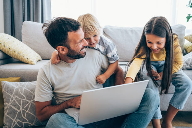 istock Father trying to work from home. 1318463647