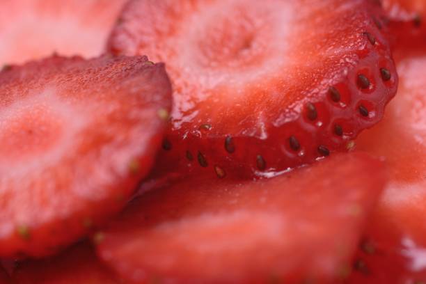 istock Sliced strawberry slices close up 1318463654