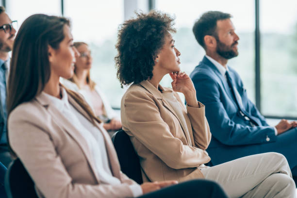 istock Business persons having a training class in a board room. 1318463660