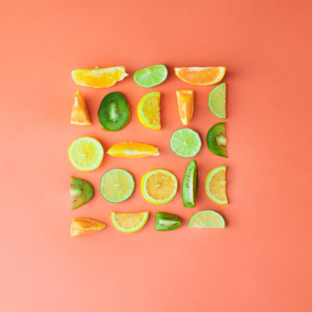 istock Fresh summer lined chopped fruit on  an apricot background. Minimal flat lay 1318464129