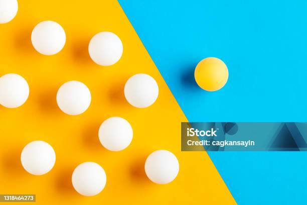 Table Tennis Balls In Contrast Diversity Difference Opposition Exclusion Or Confrontation Stock Photo - Download Image Now