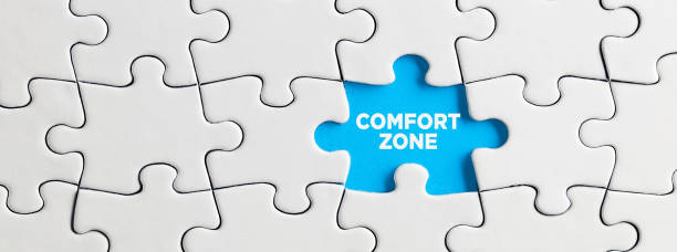 istock Blue missing puzzle piece with the word comfort zone. Stuck in the comfort zone 1318464986