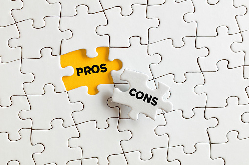 The words pros and cons on the missing puzzle pieces. To discover the positive aspects underlying the negative aspects concept.