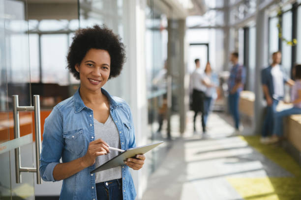 istock A successful female web designer using digital tablet in the office hallway 1318466633