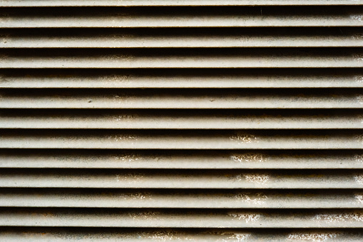 dirty stained metallic jalousie pattern close up, abstract rusty metal stripes wall texture, steel textured vintage lattice shutter, abstraction with geometry lines, iron blind, grunge background