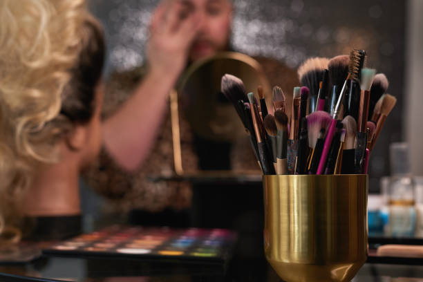 istock Shot of an unrecognisable man applying makeup backstage 1318469559