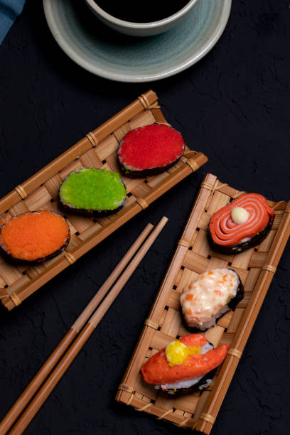 istock Sushi in bamboo on black background 1318470004