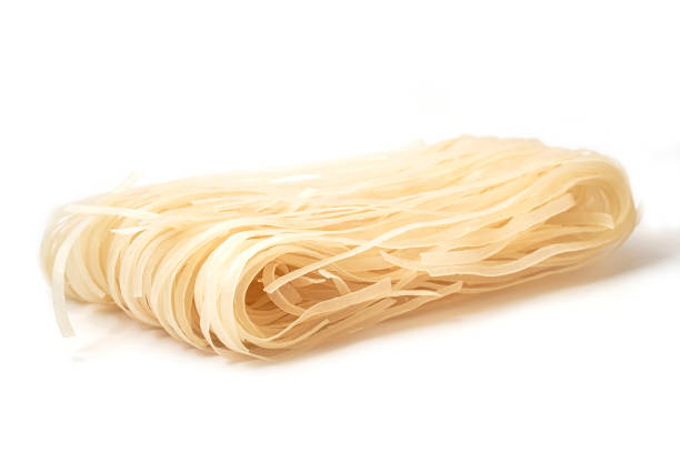 istock Raw Rice Noodles isolated on white background. 1318471102