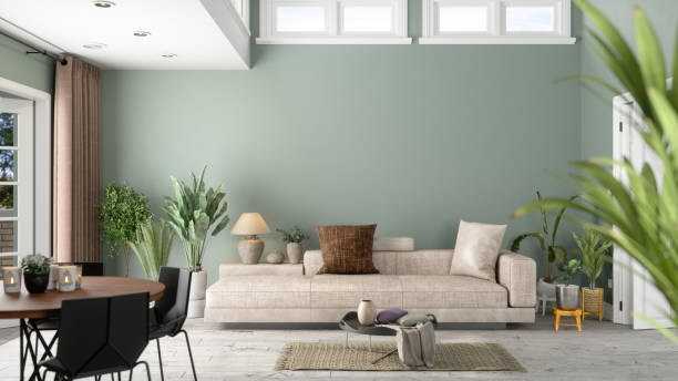 modernes wohnzimmer-interieur mit grünen pflanzen, sofa und grünem wandhintergrund - wohngebäude stock-fotos und bilder