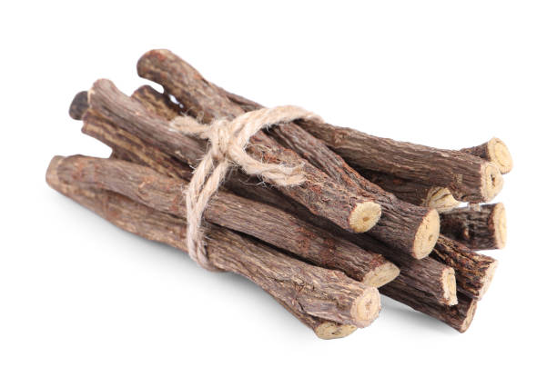 istock Dried sticks of liquorice root on white background 1318472511