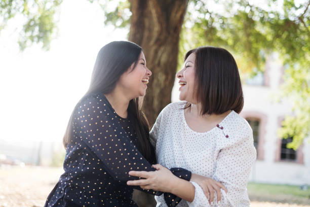 istock Happy mother and daughter laughing 1318472565
