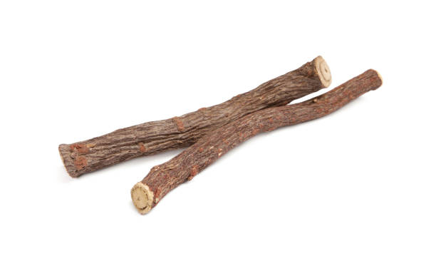 istock Dried sticks of liquorice root on white background 1318472780