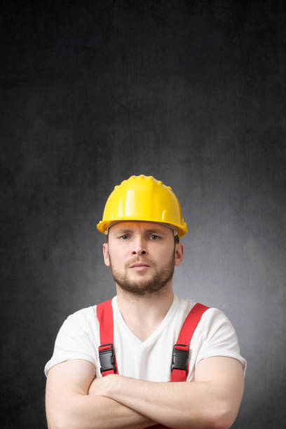 istock Annoyed construction worker with his arms crossed 1318473716