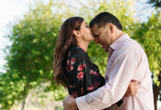 istock Lovely wife kissing husband on forehead 1318474924
