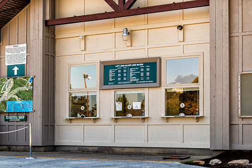 Basye, USA - October 7, 2020: Ticket counter building window for Bryce ski resort lift passes in Virginia rural countryside Shenandoah county with sign