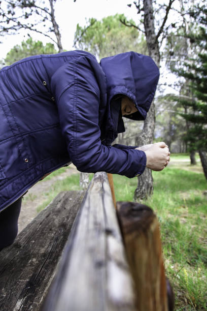 istock Hooded woman in the forest 1318478824