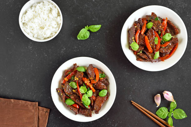 istock Thai beef stir-fry with pepper and basil in bowl 1318478873