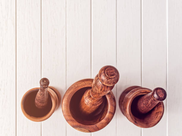 istock Wooden mortars and pestles for grinding spices. 1318480215