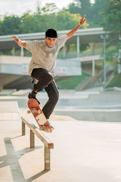 istock Asian male skateboarding in a skate park 1318482292