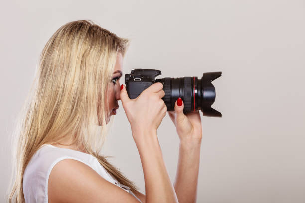 istock Beautiful woman with camera. 1318482523