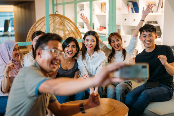 istock Multi-Ethnic Colleagues taking selfie after project conference in company 1318483883
