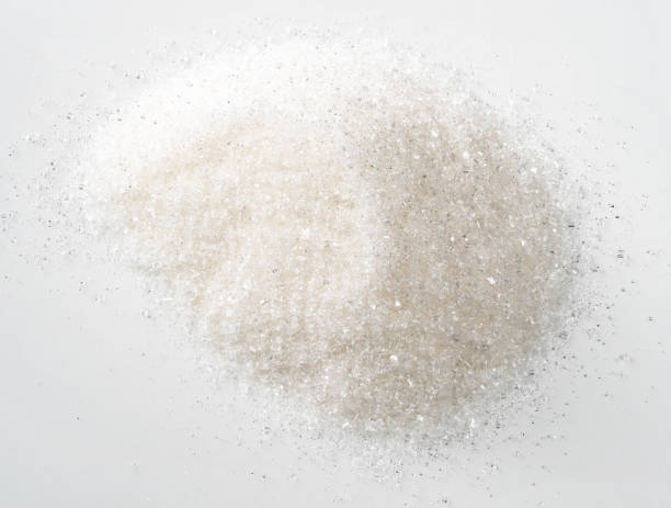 istock handful of white sugar from sugar beet on white 1318484613