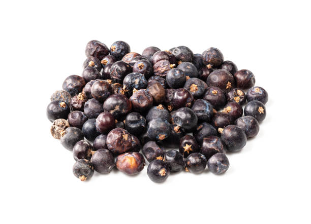 istock handful of dried juniper berries closeup on white 1318484633