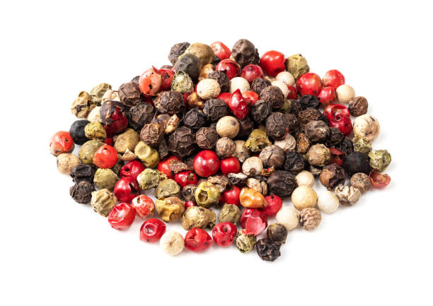 istock pile of Four Pepper Blend closeup on white 1318484642
