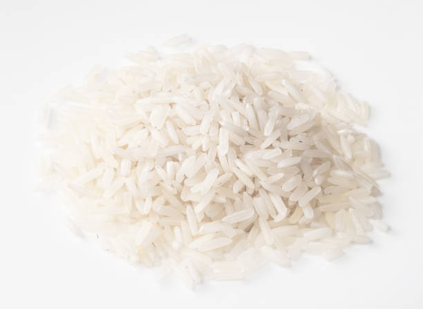 istock handful of raw long-grain polished rice on white 1318484711