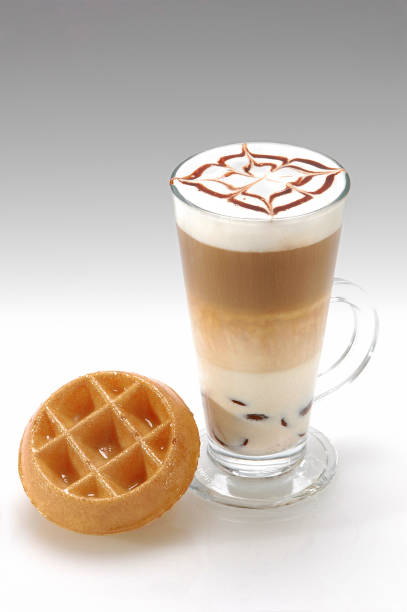 Caffee late served with waffle sugar glaze and white background
