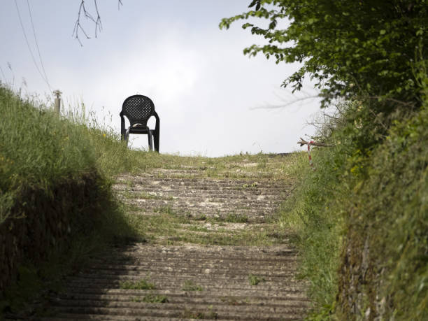 empty chair on top of the hill stairway
