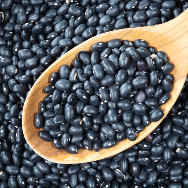 istock black mexican beans in wooden spoon closeup 1318486086