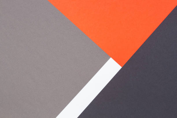 istock Creative abstract geometric paper background orange, white, light gray, black colors paper 1318488062