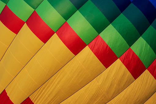 colorful fabric of a hot air balloon in yellow, red, green and blue
