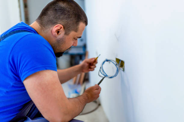 Electrician connecting wires Young male electrician connecting wires in the wall dimmer switch photos stock pictures, royalty-free photos & images
