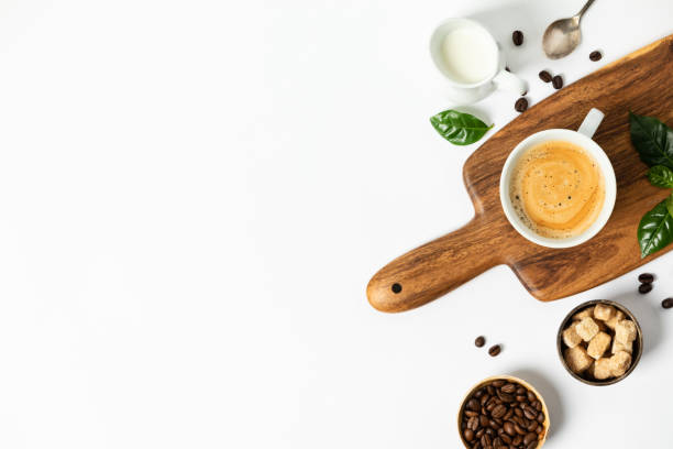 istock Cup of coffee on a wooden cutting board, flat lay, top view, copy space 1318490619