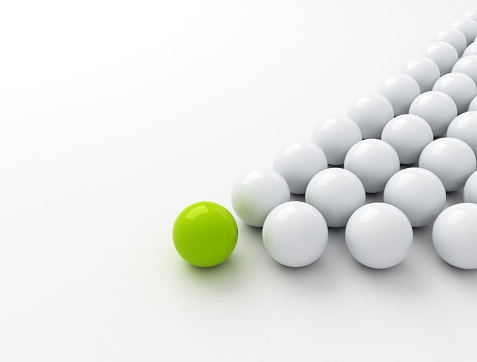 Green ball ahead of white balls. Business leadership concept 3d render