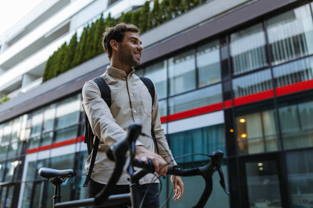 istock Businessman commuting to work with his bicycle 1318491899