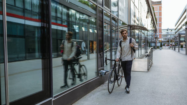 istock Businessman walking his bicycle to work 1318491901
