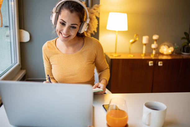 istock Young woman working late from home 1318492703