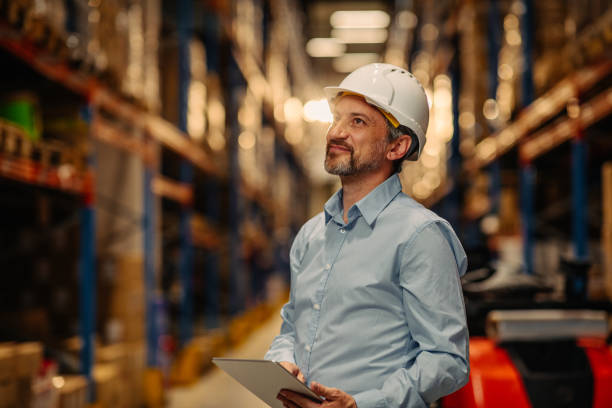 istock Warehouses manager looking over the inventory 1318493328