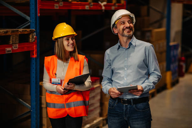 istock Warehouse staff meeting, worker with manger 1318493334