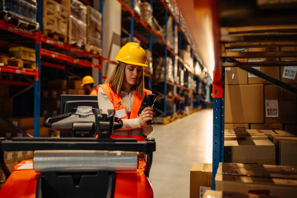istock Logistics and transport worker in a warehouse 1318493335
