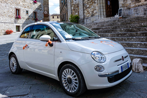 Fiat 500 decorated for wedding in the Historic center of Castellina in Chianti, Tuscany, Italy, Europe\